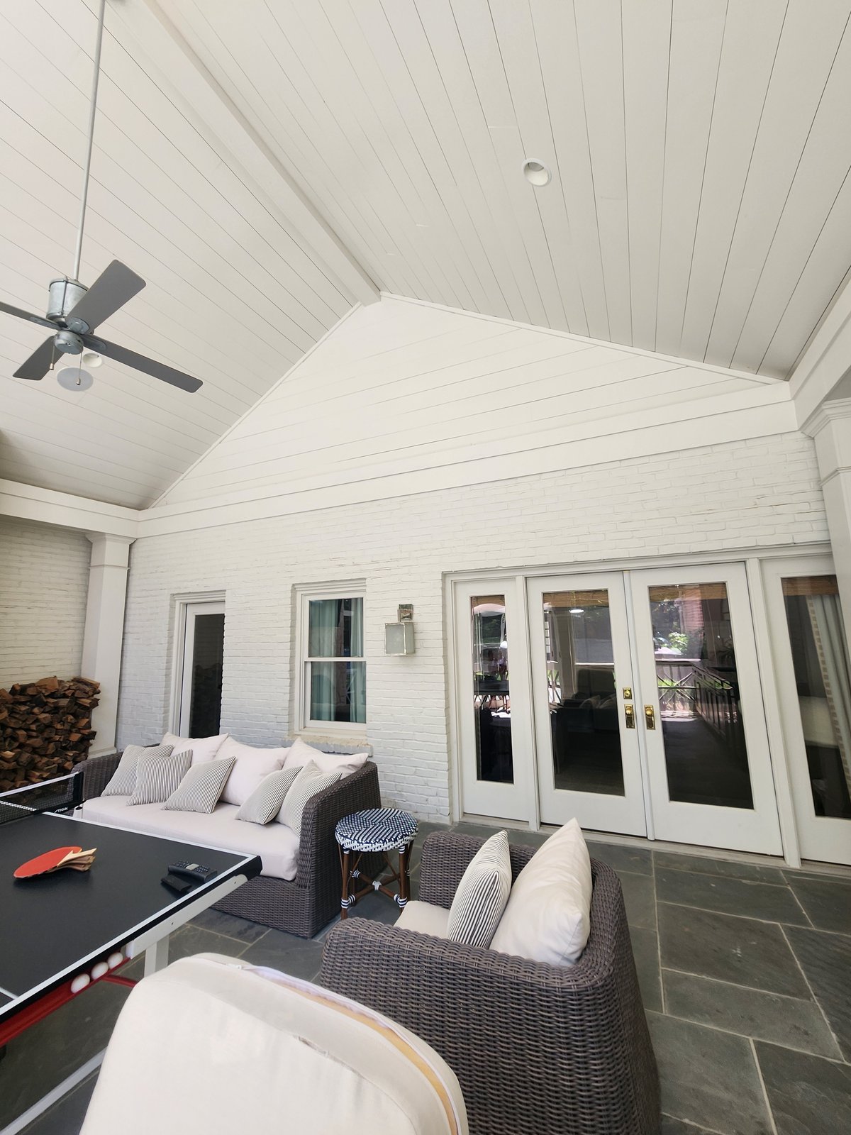 Light blue-gray bungalow with white trim after a fresh exterior repaint — Lou's Atlanta Painting