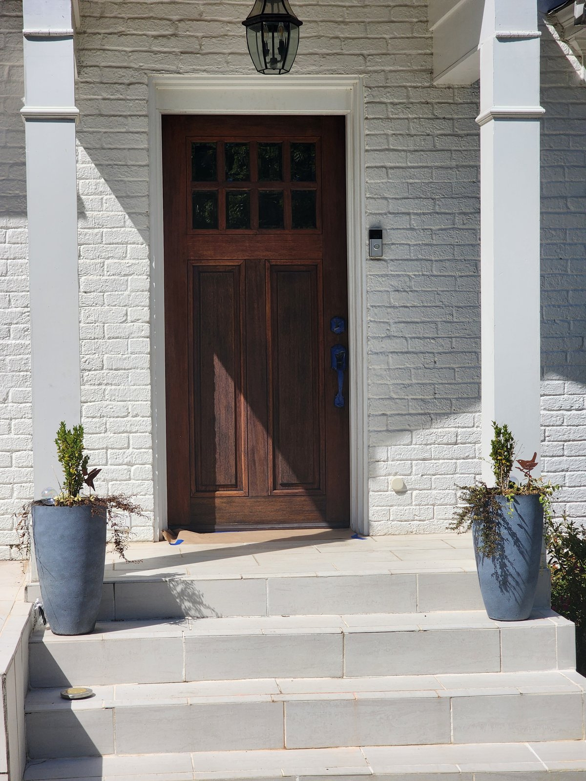 Large two-story estate home with a circular drive after an exterior repaint — Lou's Atlanta Painting
