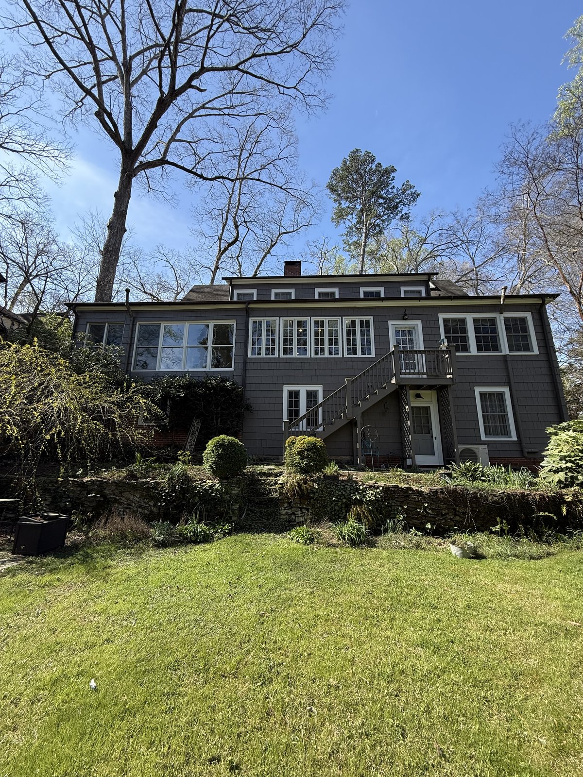 White modern farmhouse with covered porch — exterior repaint by Lou's Atlanta Painting