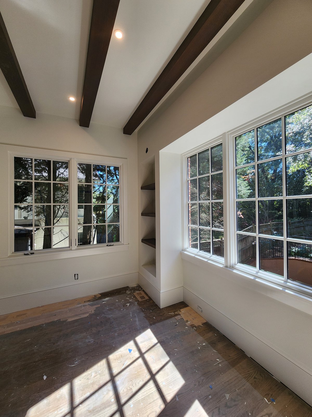 Vaulted-ceiling family room with skylights and neutral palette — interior repaint by Lou's Atlanta Painting
