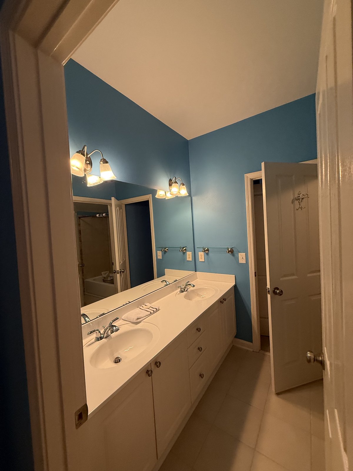 Powder room repaint in fresh light blue and white — Lou's Atlanta Painting