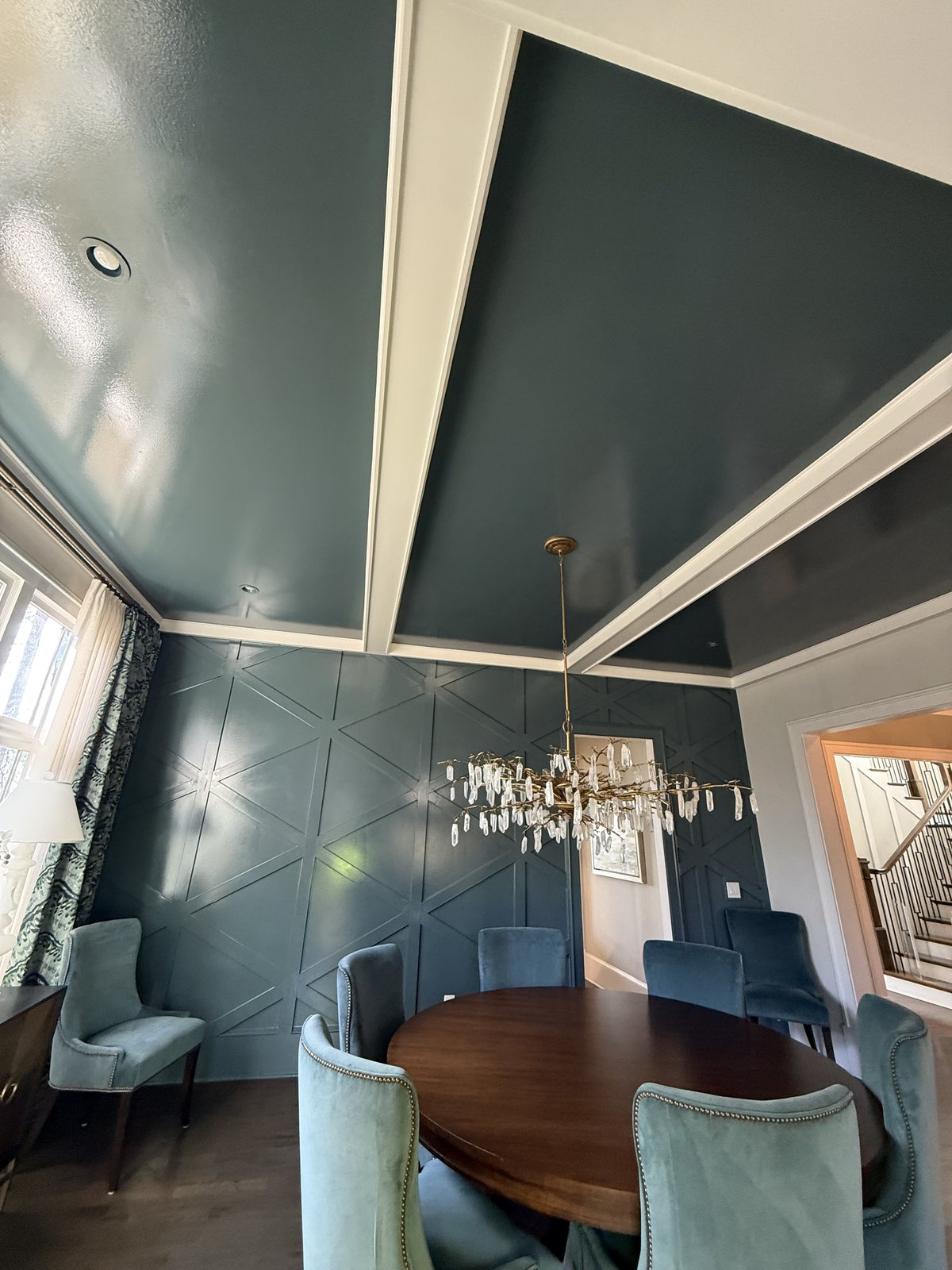 Formal dining room repainted in deep navy with white trim — Lou's Atlanta Painting