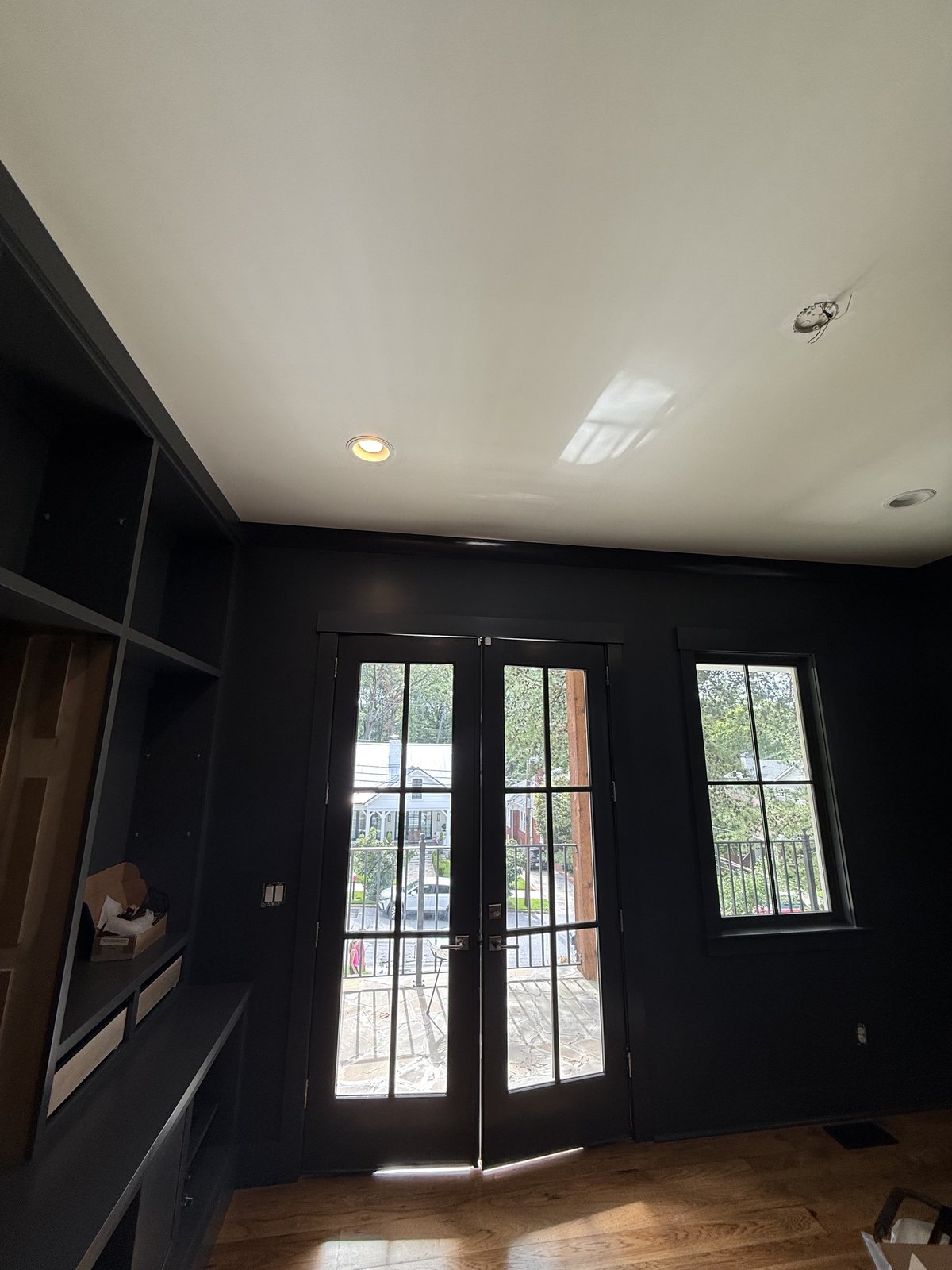 Accent room with deep charcoal walls and warm wood floors — Lou's Atlanta Painting
